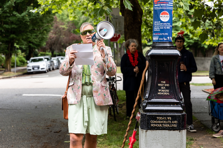 Andrew Sorfleet reading from Prof. Becki Ross at West End Sex Workers Memorial for Red Umbrella March on June 10, 2023.